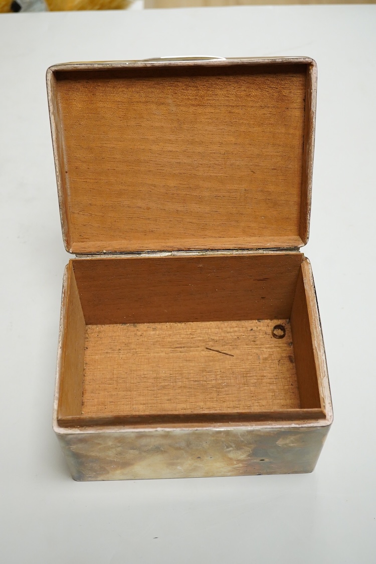 A 1930's silver mounted cigarette box, hallmarks rubbed, length 15.6cm, height 9cm.